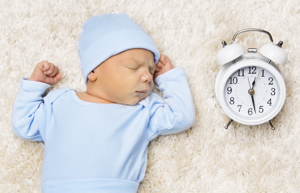 bigstock Sleeping Newborn Baby And Cloc 120760349 1 1024x660